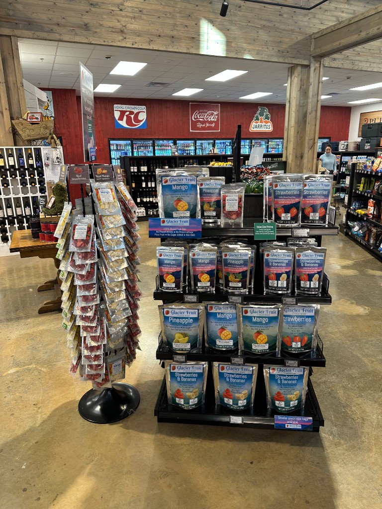 Glacier Fruit spinner and shelf displays inside a convenience store